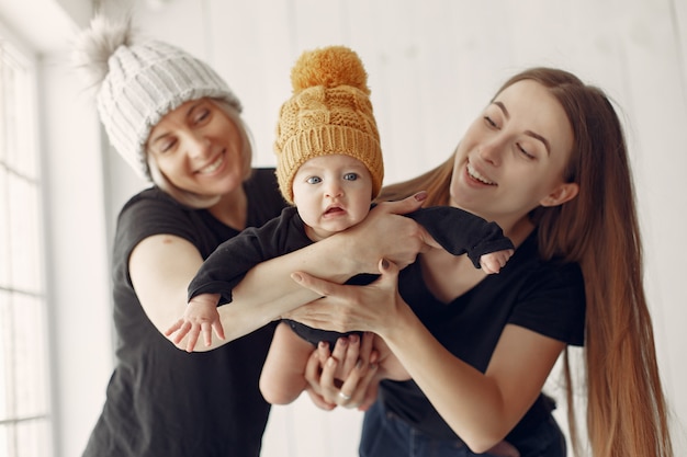 Elegant grandma at home with daughter and grandson