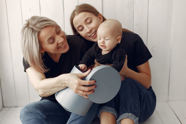 Elegant grandma at home with daughter and grandson