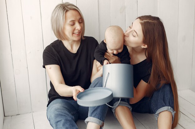 Elegant grandma at home with daughter and grandson