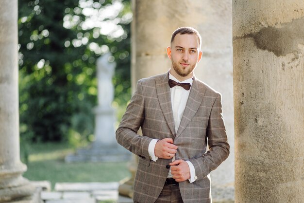 Elegant groom with black bowtie