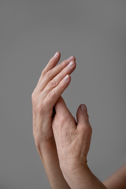 Elegant hands of old woman