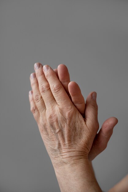 Elegant hands of old woman