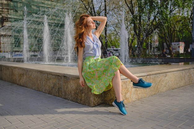 Elegant lady walking alone in the street