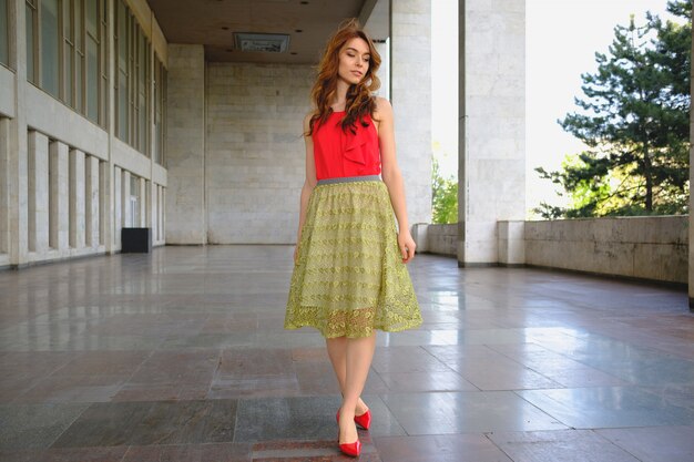 Elegant lady walking alone in the street