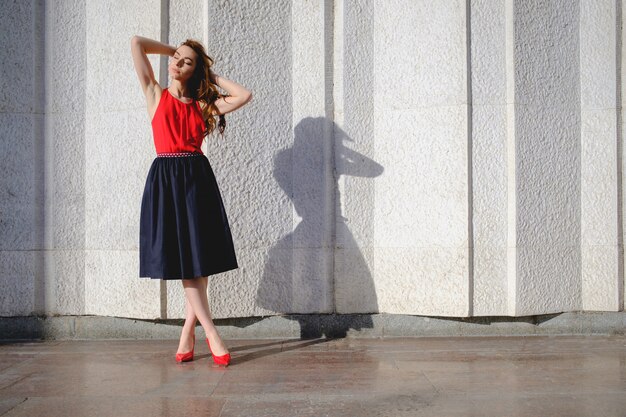 Elegant lady walking alone in the street