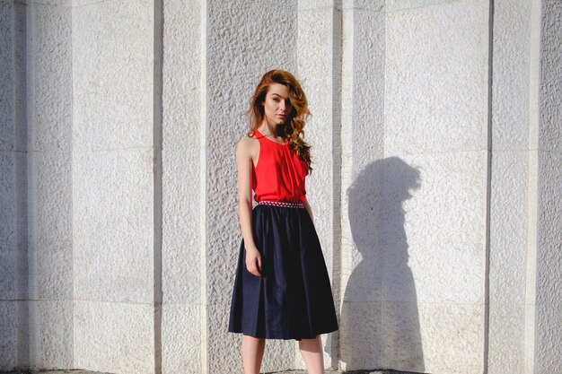 Elegant lady walking alone in the street