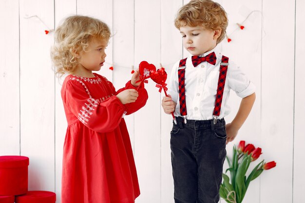 Elegant little kids with bouquet of tulip