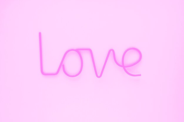 Elegant love writing on pink