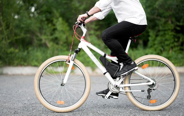 Elegant male riding bicycle outdoors