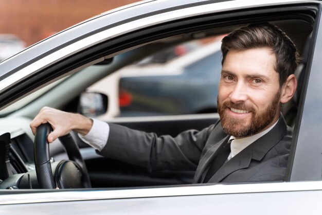 Elegant male taxi driver in costume