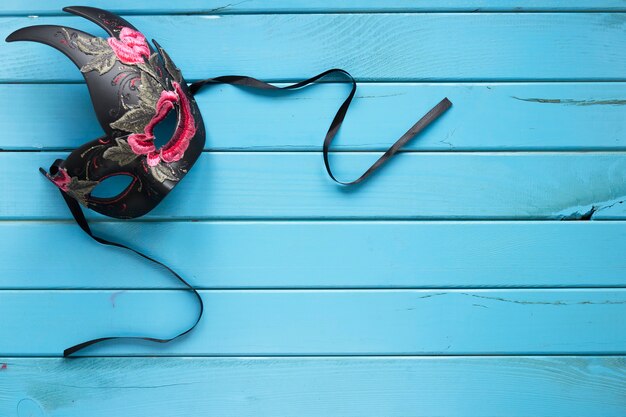 Elegant mask on turquoise background