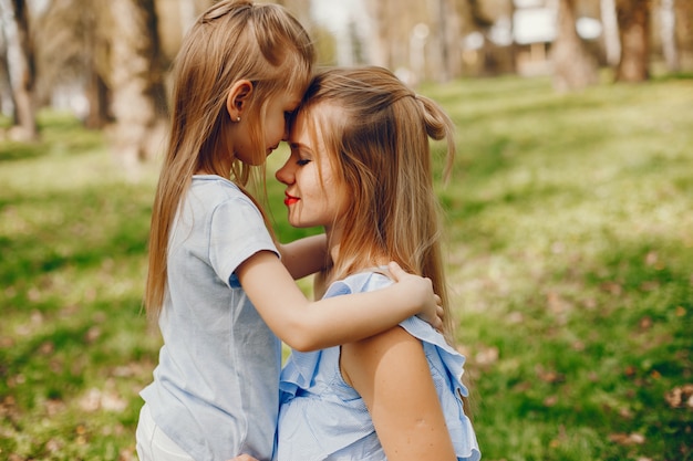 elegant mother with cute daughter 