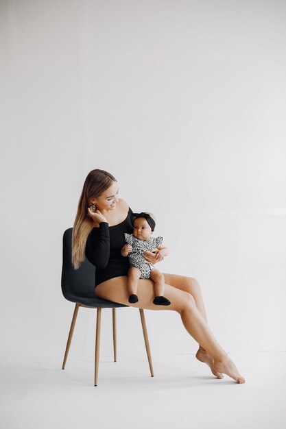 Elegant mother with cute little daughter