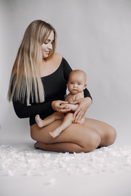 Elegant mother with cute little daughter 