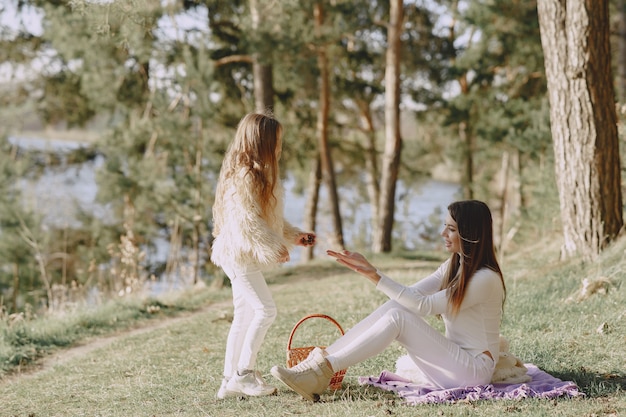 Elegant Mother and Daughter in a Summer Forest – Free Download