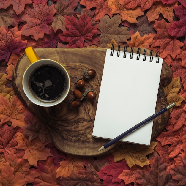 Free photo elegant notepad and coffee autumn set