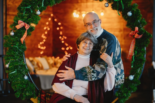 An elegant old couple are celebrating Christmas