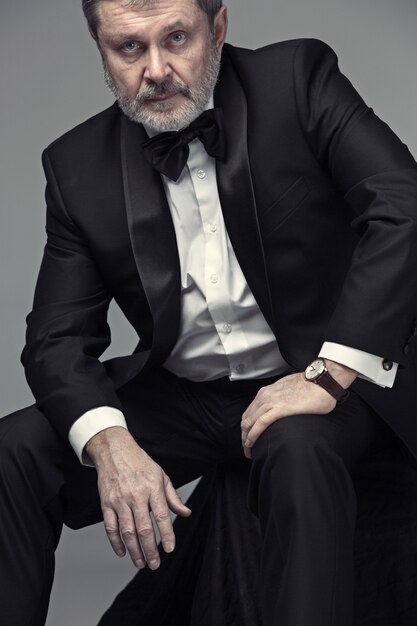 Elegant senior businessman in tuxedo