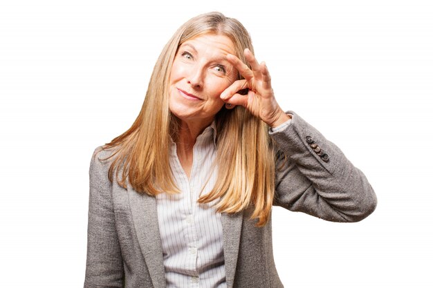 Elegant senior woman with hand on face