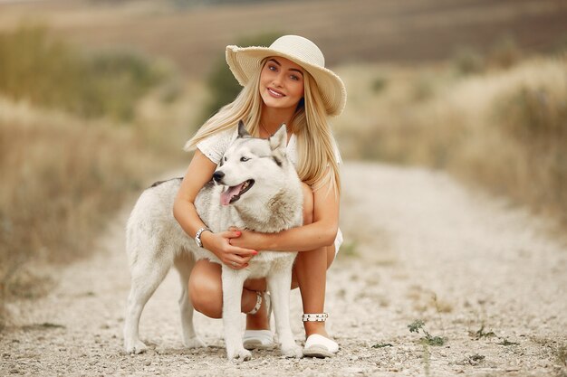 Elegant and stylish girl in a autumn field