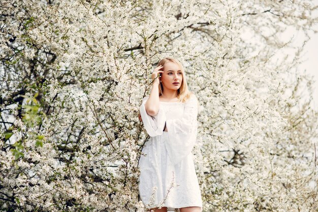 Elegant and stylish girl in a spring park