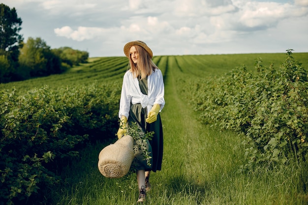 Elegant and stylish girl in a summer field