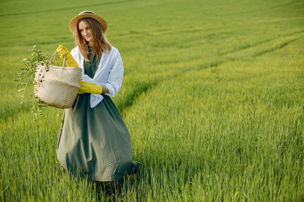 Elegant and stylish girl in a summer field