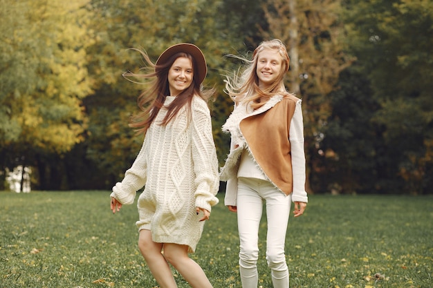 Elegant and stylish girls in a park