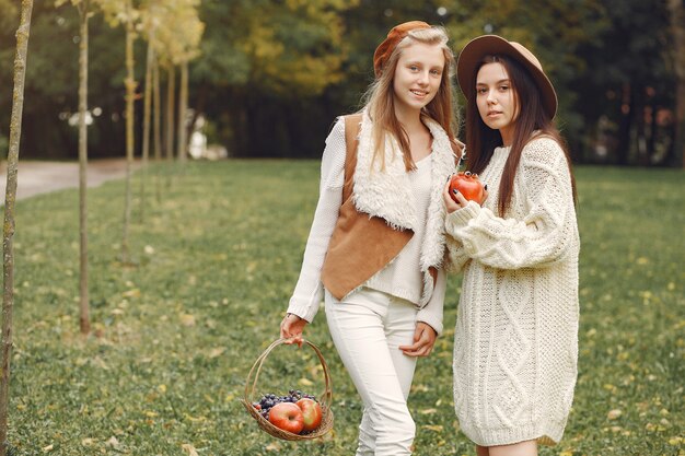 Elegant and stylish girls in a park