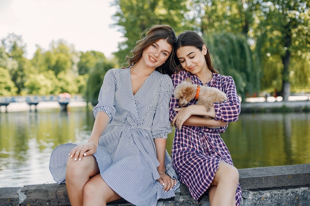 Elegant and stylish girls in a spring park