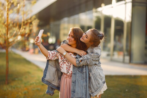 Elegant and stylish girls in a summer park