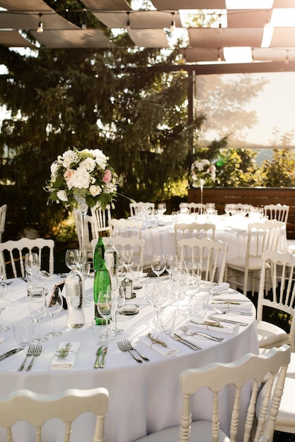 Elegant table setting at an outdoor wedding reception.