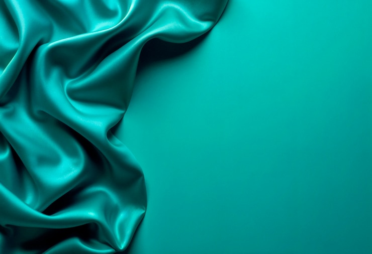 Free Photo elegant teal silk fabric background