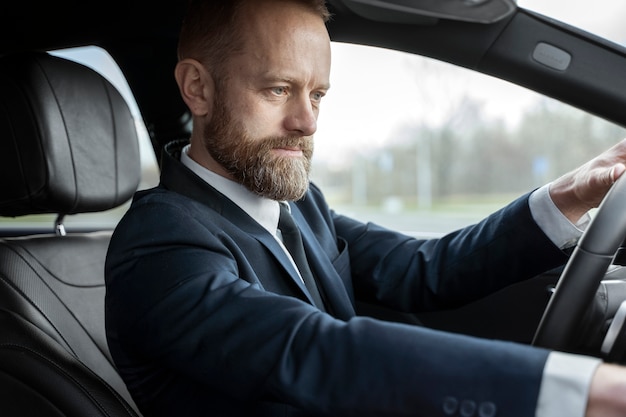 Free photo elegant uber driver giving taxi ride