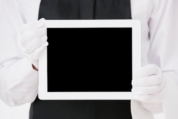 Free photo elegant waiter holding tablet mock-up