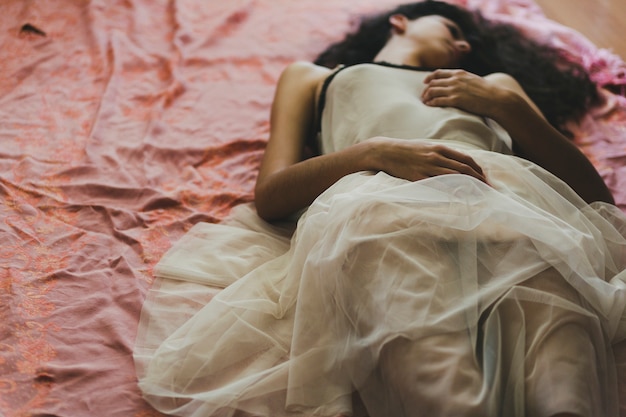 Elegant woman lying on floor