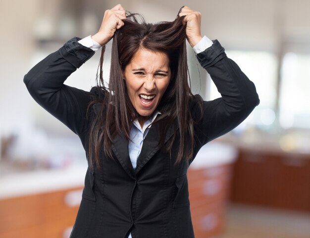 Elegant woman pulling her hair