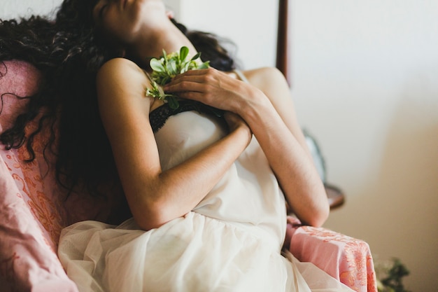 Elegant woman sleeping with flowers