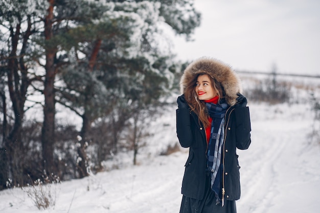 Elegant and young girl in a winter park