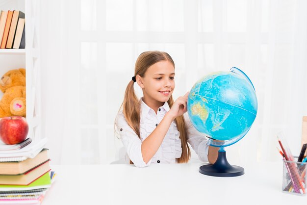 Elementary school girl with globe