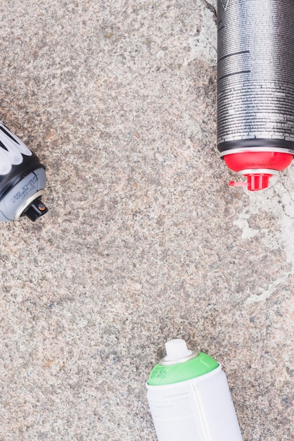 Elevated view of aerosol cans on floor
