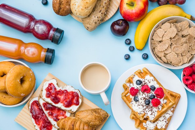 Elevated view of breakfast on blue background