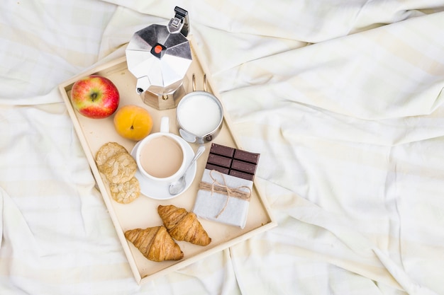 Elevated view of breakfast on crumpled blanket