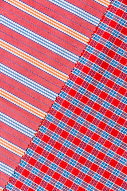 Elevated view of chequered and straight lines pattern textile