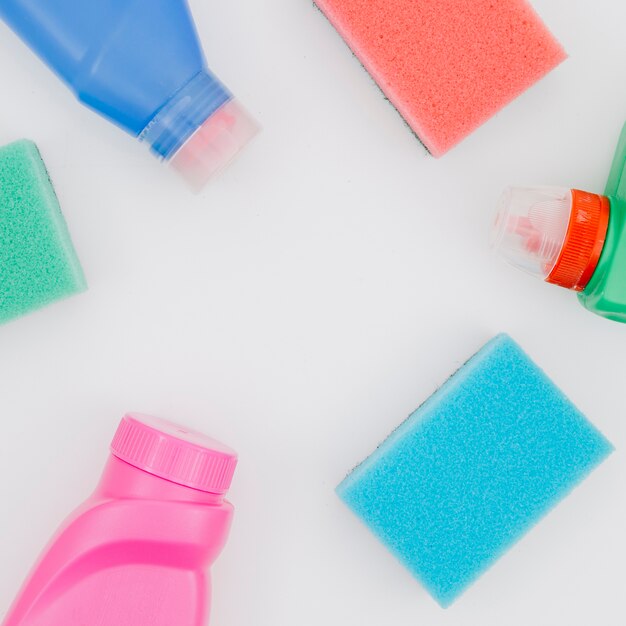 An elevated view of cleaning supplies on white backdrop