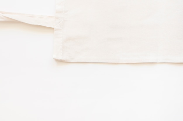 Elevated view of cotton bag over white background