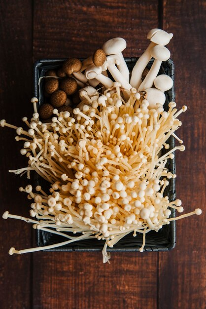 Elevated view of crate with variety of mushrooms