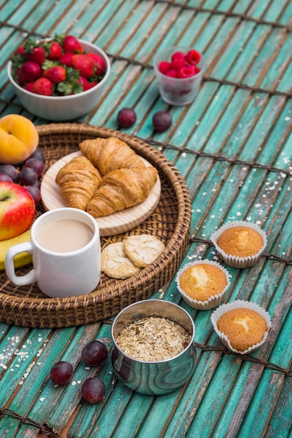 Elevated view of delicious breakfast on wooden surface