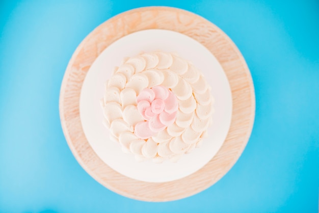 Elevated view of a delicious cake over blue background