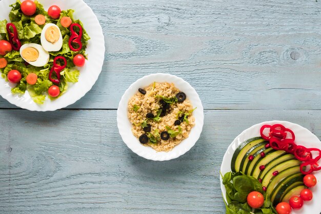 Elevated view of different types of healthy foods with boiled egg and fresh vegetables